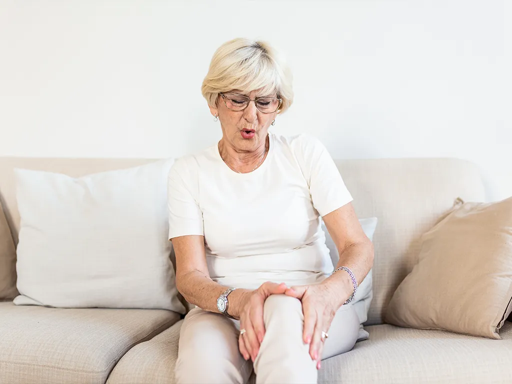 Woman suffering with joint pain. 
