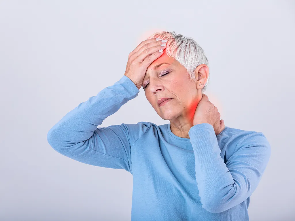 Woman holding head and neck with neuropathic pain