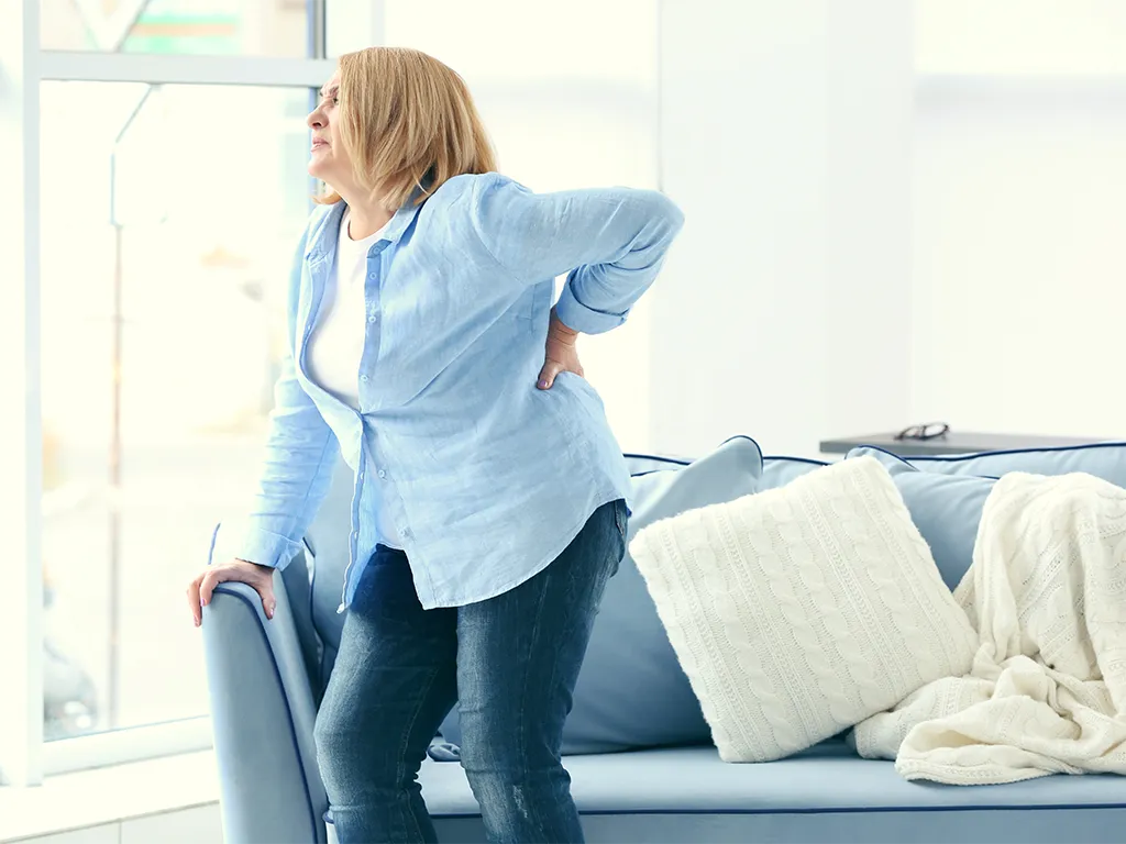 Woman suffering from spinal pain